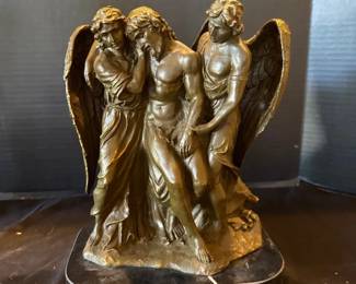 A Bronze Sculpture Titled the Dead Christ Supported by Angels