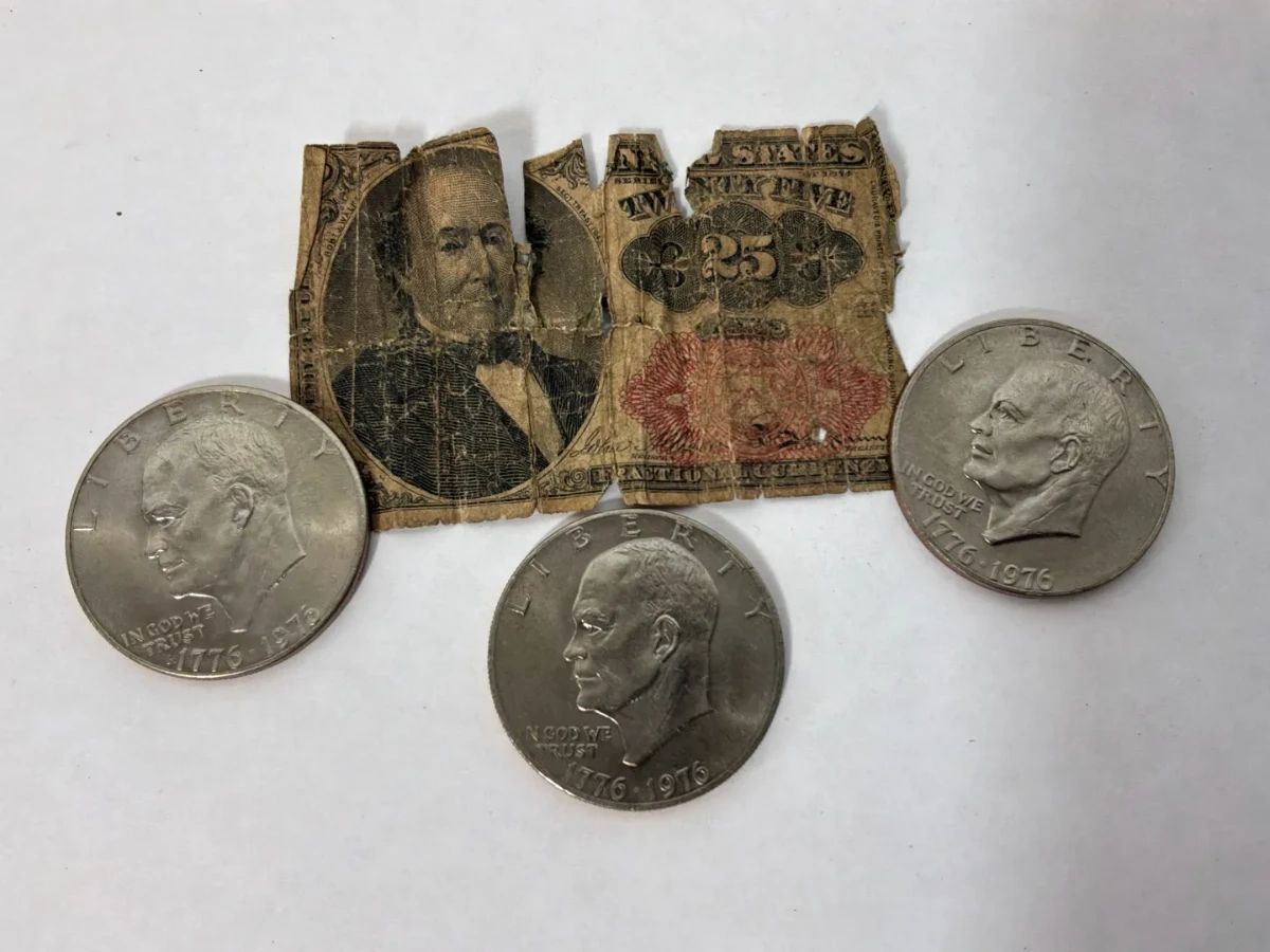 1874 $.25 Fractional Currency Fragment and Three 1976 Eisenhower Dollars