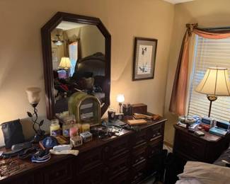 Yankee candles, cvintage lamos, traditional dark wood dresser and mirror, accessories, glasses.