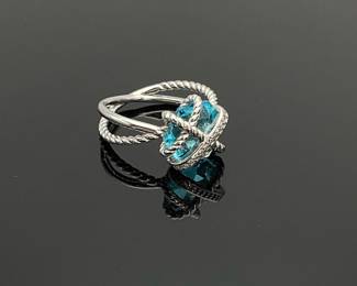 Silver cable crossover ring with twist