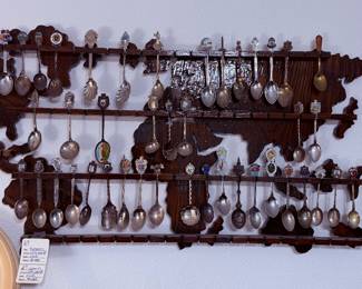 #67. $100 Spoon collection with world wall rack