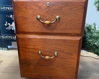 #24. $60 Wood file cabinet with black top 25h,16w,24d