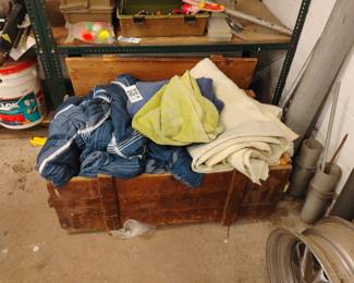 Lot 195: Wooden Storage Crate with Bedding and Towels