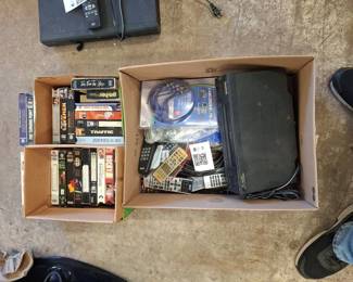 Lot 159: VHS Tapes, VCR, Remote Controls, and Audio Video Cables