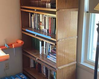 Lot 54: Bookcase With Glass Sliding Doors