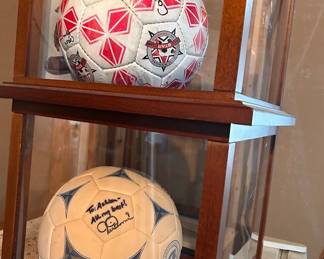 Signed soccer balls including one signed by Mia Ham