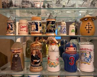 Display case of character and German beer steins