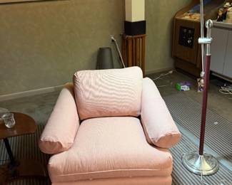 Upholstered armchair with arc floor lamp
