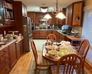 Kitchen with wood cabinets and a dining table