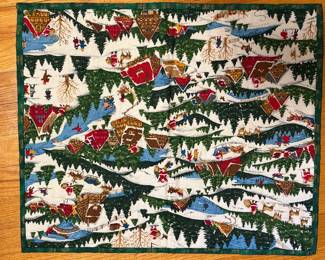 Handmade Christmas quilt with cabins, evergreens and sleigh print