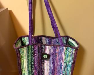 Handmade quilted tote bag in purple and green batik