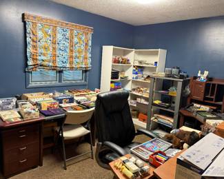 Craft room with desk, shelving and work area