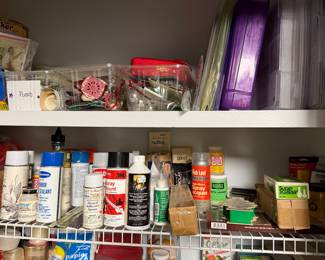 Shelves of craft paint, adhesives and finishing supplies