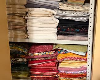 Shelves of folded quilting cotton and batting