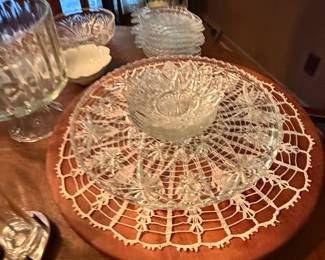 Pressed glass bowl on a crocheted doily