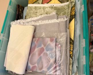 Bins of home decor fabric and upholstery weight yardage