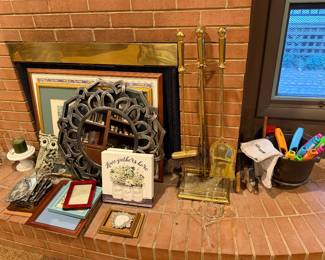 Fireplace with tool set, framed art and decor