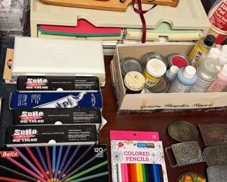 Solid Ink boxes and craft paints in a drawer