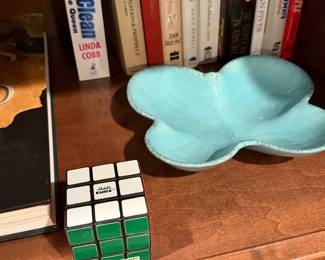 Turquoise glazed ceramic dish and a puzzle cube