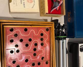 Framed Chinese checkers board and tripod