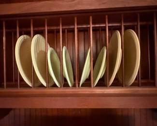 Plate rack with green and cream dinner plates