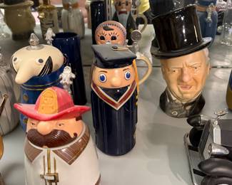 Figural character steins with hat and head lids