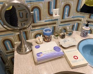 Vanity with lighted makeup mirror and bath accessories