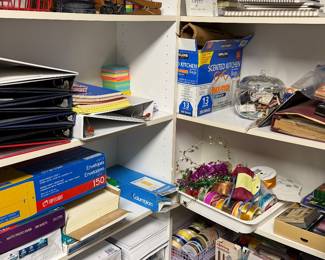 Shelves of craft supplies, binders and boxed kits