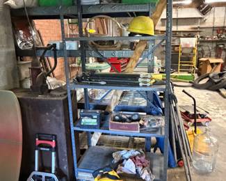 Garage shelving with rolling creeper and shop equipment