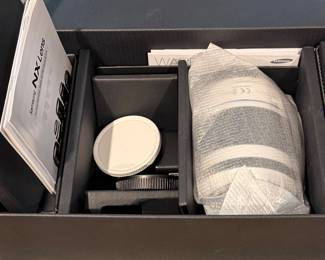 Boxed Nikon camera body with manual and accessories