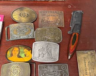 Vintage belt buckles, pocket knife and small collectibles