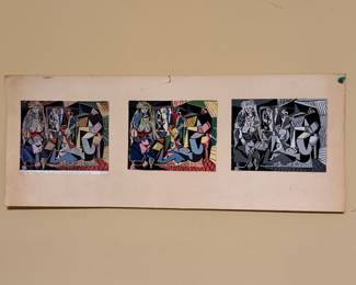 Three framed folk art textile panels on a wall
