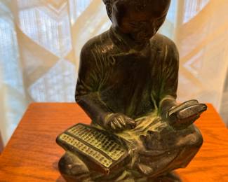 Bronze figure of a seated scholar reading