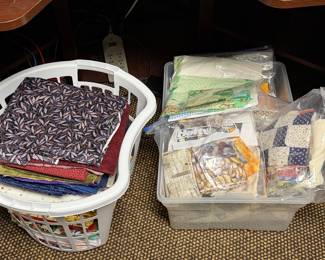 Laundry basket and bin of folded fabric and project kits