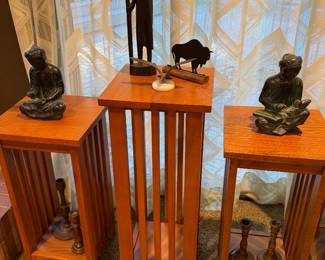 Mission style pedestal tables with bronze figures