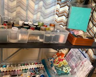 Trays of buttons, beads, bobbins and small sewing notions