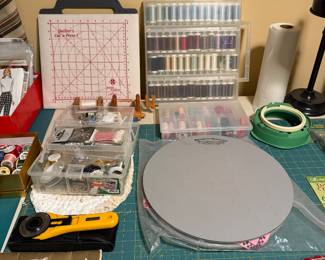 Cutting mat, quilting rulers and thread storage on a work table