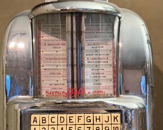 Seeburg jukebox selection panel with title strips