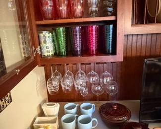 Cabinet of stemware, mugs and colored glass tumblers