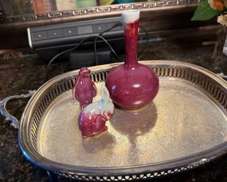 Cranberry glass bud vase on a silver plate gallery tray