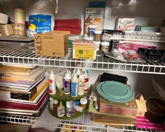 Shelves of craft paints, glues and supplies