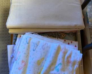 Folded pastel baby quilts and fabric