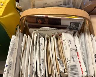 Basket and boxes of filed sewing patterns