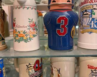 Advertising steins including baseball and brewery designs