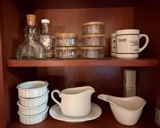 Cabinet with glass canisters and mugs