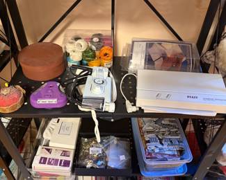 Shelf with sewing machine accessories and storage boxes