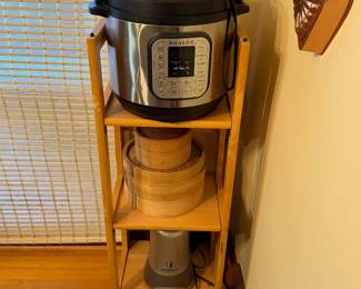 Instant Pot electric pressure cooker on a wood stand