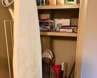 Closet with ironing board and storage
