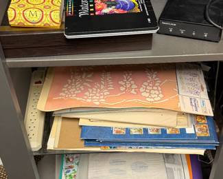 Shelf with binders, folders and reference books