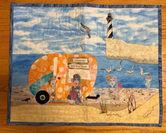 Handmade beach scene quilt with vintage camper and lighthouse